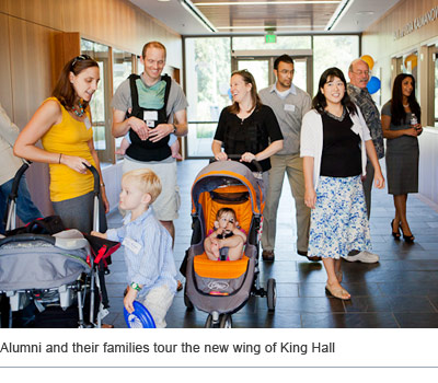 Alumni and their families tour the new wing of King Hall