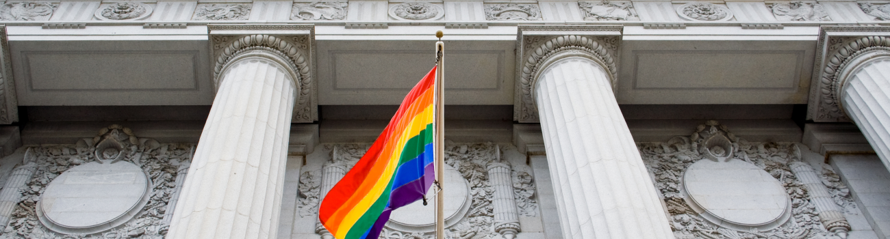 LGBTQ+ Flag in front of courthouse