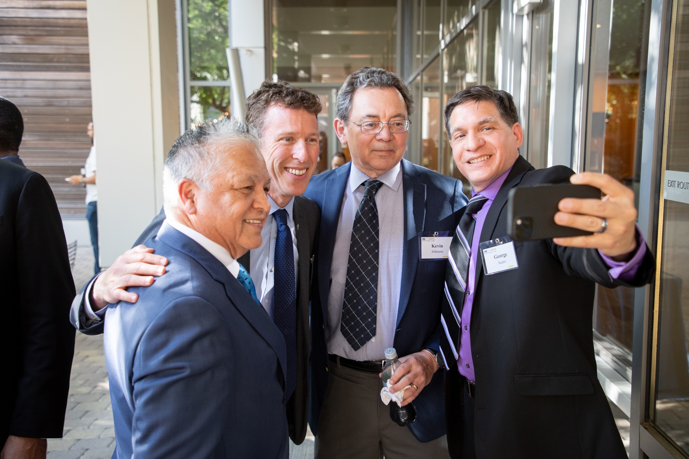 A group of four individuals taking a selfie.