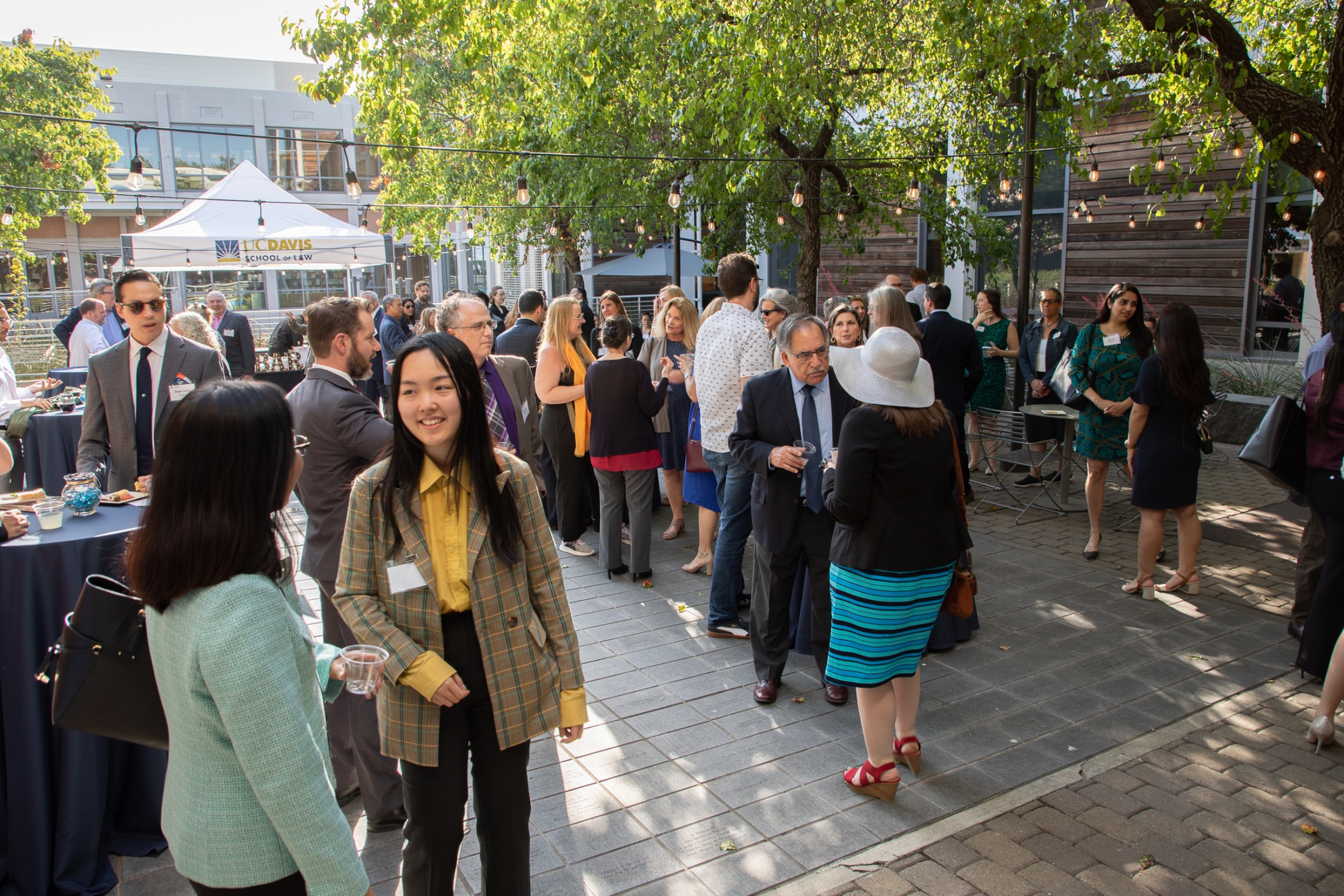 Individuals mingling at the Yolo County Unity Bar reception at King Hall.