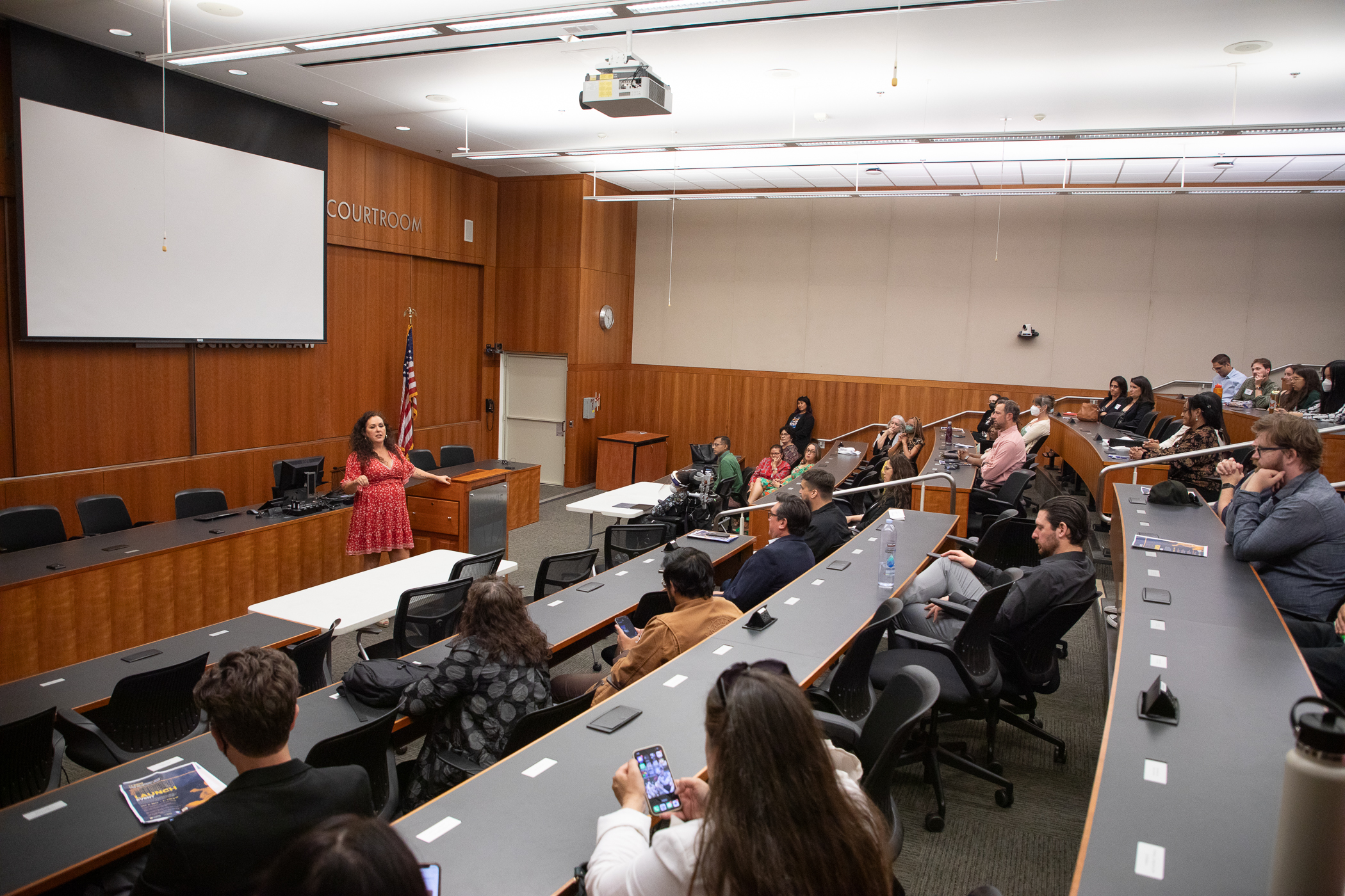 A woman giving a presentation at King Hall.