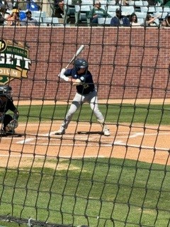 A UC Davis baseball player playing against Cal Poly SLO.