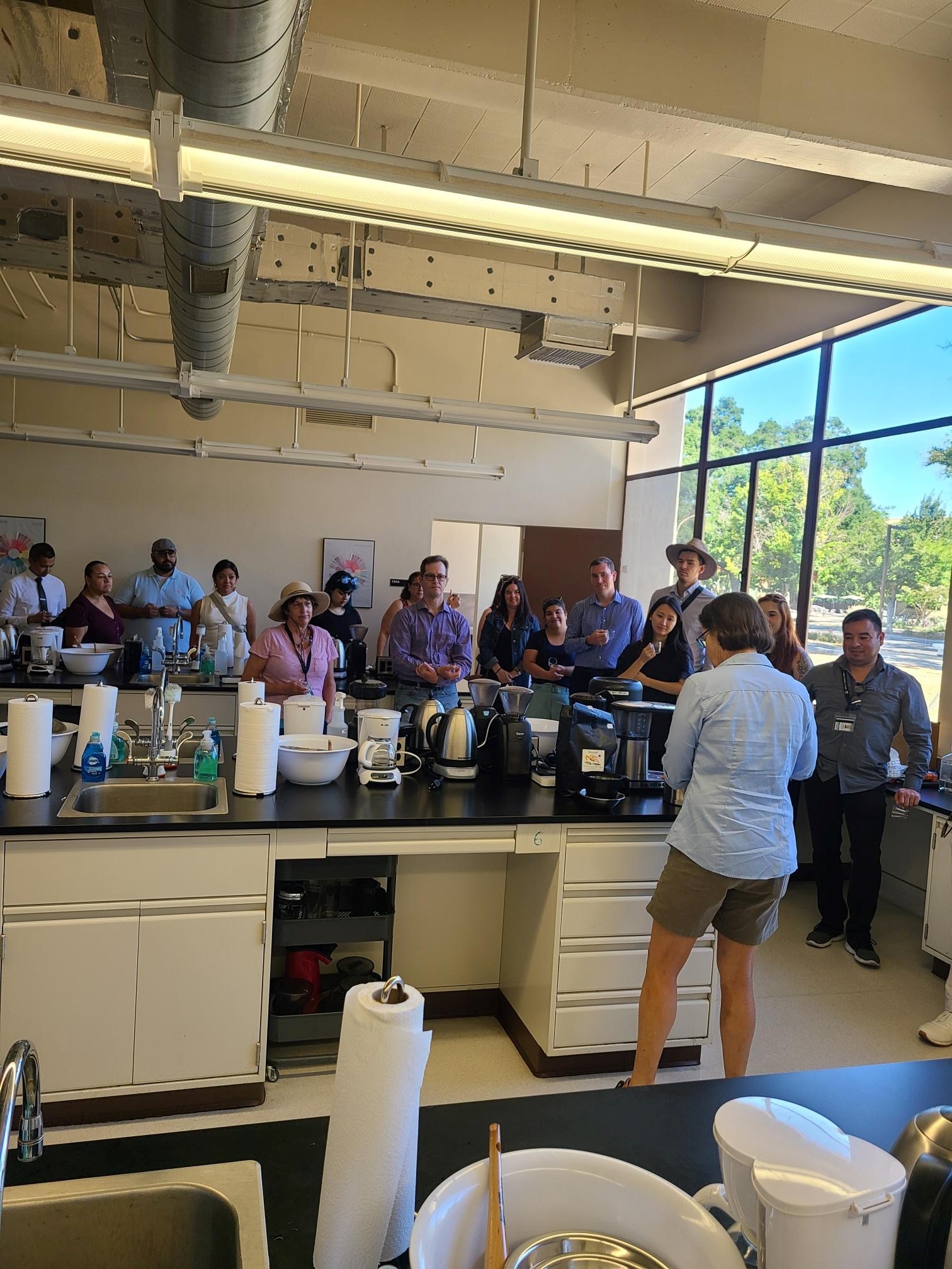 King Hall staff getting a tour of the UCD Coffee Lab on campus.