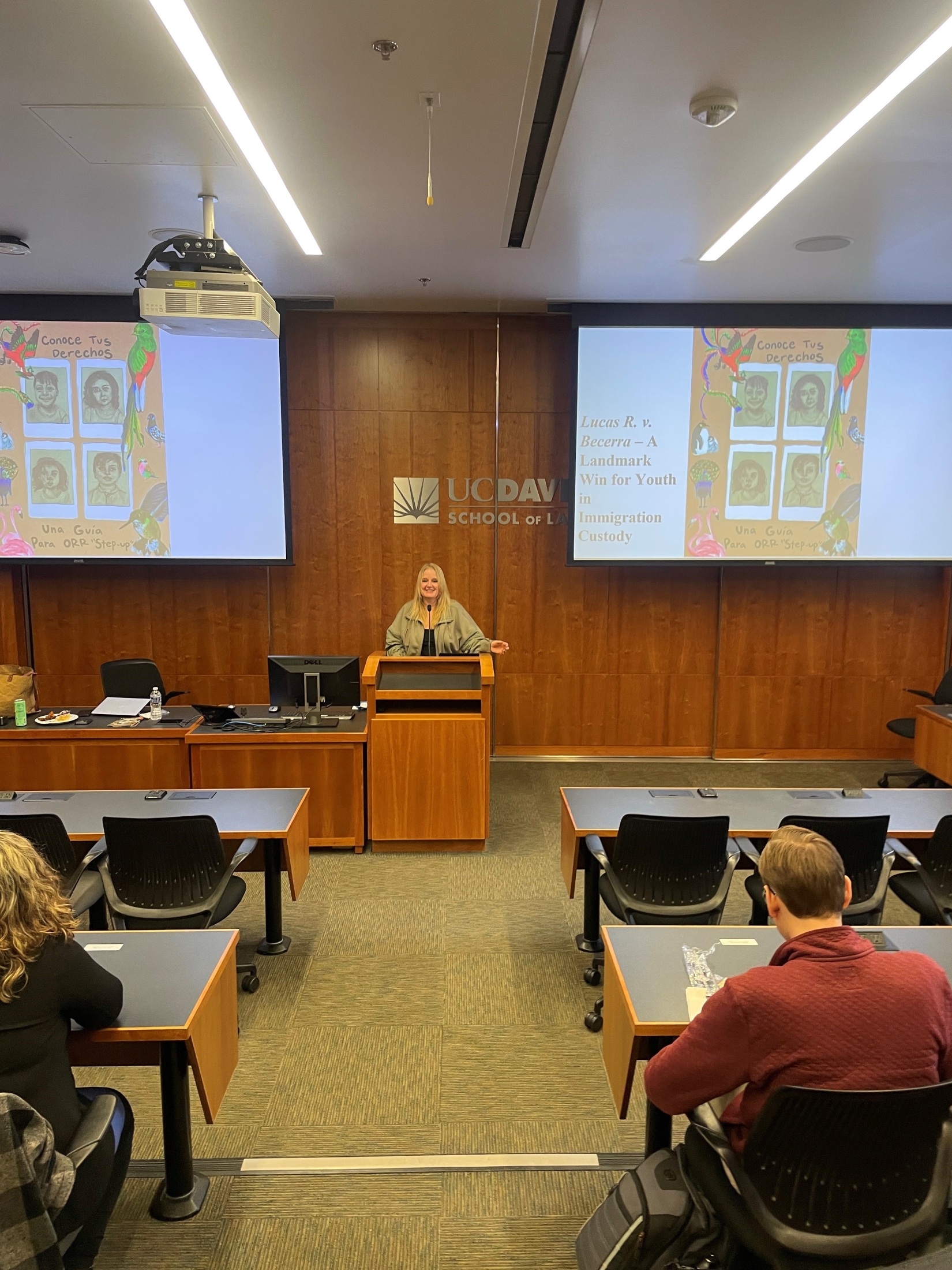 UC Davis Law Professor and Co-director of the Immigration Law Clinic, Holly Cooper, speaking at the podium to a room full of students.