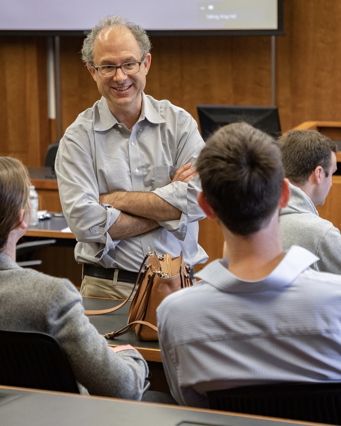 Professor Darien Shanske smiling while speaking to students at King Hall.