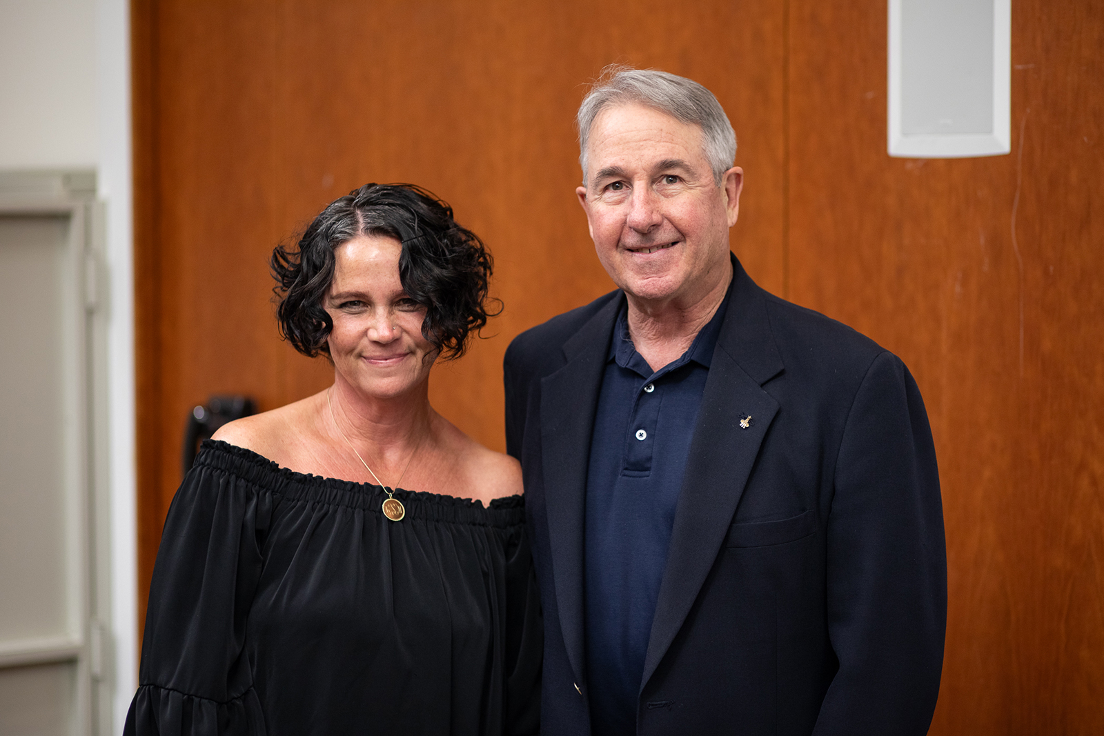 A man and woman standing next to each other.