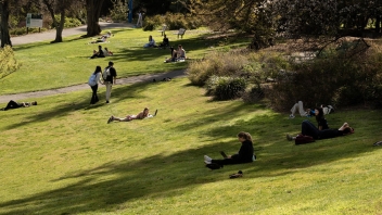 Students reading and relaxing in the Arboretum.
