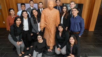 KHOP students standing around the MLK statue at King Hall.