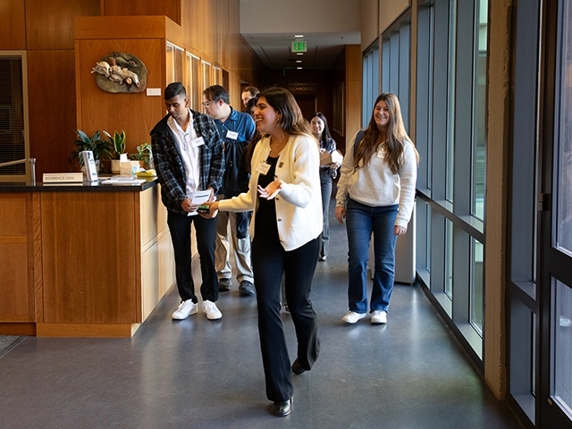 A UC Davis Law student giving a building tour of King Hall to prospective applicants.