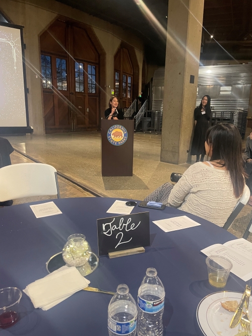 Judge Kara Ueda '00 at the podium.