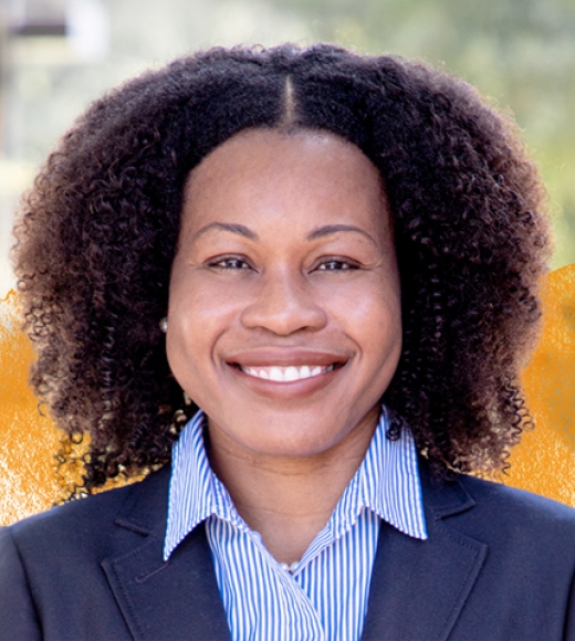 UC Davis Law Professor Stacy-Ann Elvy smiling with a yellow gradient behind her.